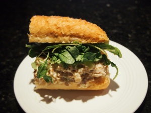 Chicken Salad Sandwich topped with Arugula